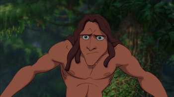 Movie still from “Tarzan” (1999), directed by Kevin Lima – A man with long brown hair and no shirt; Close Up shot, Low angle