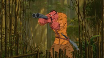 Movie still from “Tarzan” (1999), directed by Kevin Lima – An image of a man with a gun in the woods; Medium shot, Low angle