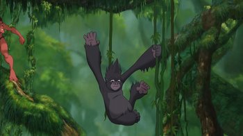 Movie still from “Tarzan” (1999), directed by Kevin Lima – An animated gorilla hanging from a tree branch; Wide shot, Low angle