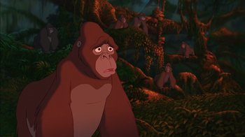 Movie still from “Tarzan” (1999), directed by Kevin Lima – A group of monkeys sitting in a forest; Medium shot, Low angle