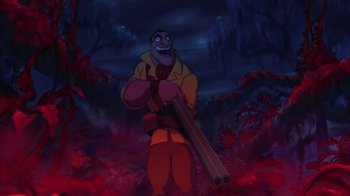 Movie still from “Tarzan” (1999), directed by Kevin Lima – An image of an animated character holding a gun; Medium shot, Low angle