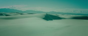 Movie still from “Teenage Mutant Ninja Turtles: Out of the Shadows” (2016), directed by Dave Green – A view of a desert landscape with mountains in the background; Extreme Wide shot, High angle