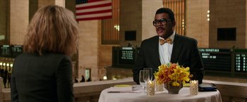 Movie still from “Teenage Mutant Ninja Turtles: Out of the Shadows” (2016), directed by Dave Green – A man sitting at a table with a glass of wine; Medium shot, Over the shoulder angle