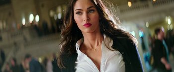 Movie still from “Teenage Mutant Ninja Turtles: Out of the Shadows” (2016), directed by Dave Green – A beautiful woman wearing a white dress shirt; Close Up shot, Low angle