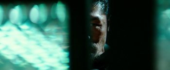 Movie still from “Teenage Mutant Ninja Turtles: Out of the Shadows” (2016), directed by Dave Green – A man's face in the dark; Extreme Close Up shot, Over the shoulder angle