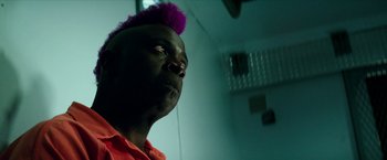 Movie still from “Teenage Mutant Ninja Turtles: Out of the Shadows” (2016), directed by Dave Green – A man with a purple mohawk is looking up; Close Up shot, Low angle