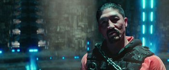 Movie still from “Teenage Mutant Ninja Turtles: Out of the Shadows” (2016), directed by Dave Green – A person wearing chains; Close Up shot, Over the shoulder angle