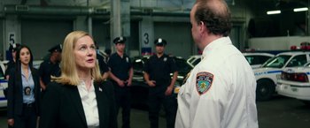 Movie still from “Teenage Mutant Ninja Turtles: Out of the Shadows” (2016), directed by Dave Green – A group of people standing next to each other in a building; Medium shot, Over the shoulder angle