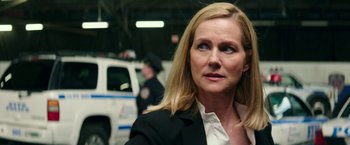 Movie still from “Teenage Mutant Ninja Turtles: Out of the Shadows” (2016), directed by Dave Green – A person wearing a suit and tie; Close Up shot, Over the shoulder angle