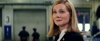 Movie still from “Teenage Mutant Ninja Turtles: Out of the Shadows” (2016), directed by Dave Green – A person wearing a suit and tie; Close Up shot, Over the shoulder angle