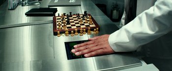 Movie still from “Teenage Mutant Ninja Turtles: Out of the Shadows” (2016), directed by Dave Green – A person playing a game of chess on a tablet; Extreme Close Up shot, High angle