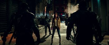 Movie still from “Teenage Mutant Ninja Turtles: Out of the Shadows” (2016), directed by Dave Green – A woman standing in the middle of a street; Wide shot, Low angle