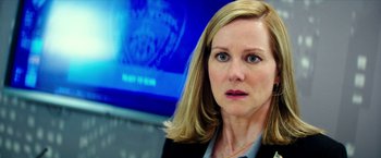 Movie still from “Teenage Mutant Ninja Turtles: Out of the Shadows” (2016), directed by Dave Green – A person wearing a suit and tie; Close Up shot, Over the shoulder angle