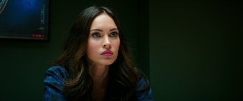 Movie still from “Teenage Mutant Ninja Turtles: Out of the Shadows” (2016), directed by Dave Green – A person with long brown hair; Close Up shot, Over the shoulder angle