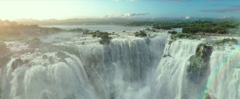 Movie still from “Teenage Mutant Ninja Turtles: Out of the Shadows” (2016), directed by Dave Green – A view of a waterfall from a distance; Extreme Wide shot, High angle