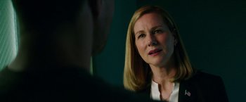 Movie still from “Teenage Mutant Ninja Turtles: Out of the Shadows” (2016), directed by Dave Green – A woman looking at a man in a room; Close Up shot, Over the shoulder angle