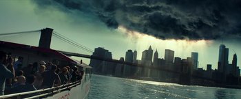 Movie still from “Teenage Mutant Ninja Turtles: Out of the Shadows” (2016), directed by Dave Green – People on a boat in front of a city skyline; Extreme Wide shot, Low angle