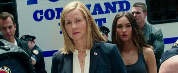 Movie still from “Teenage Mutant Ninja Turtles: Out of the Shadows” (2016), directed by Dave Green – A woman in a black jacket standing next to another woman in a black jacket; Close Up shot, Over the shoulder angle