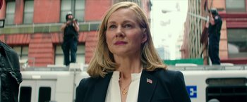 Movie still from “Teenage Mutant Ninja Turtles: Out of the Shadows” (2016), directed by Dave Green – A person wearing a suit and tie; Close Up shot, Low angle