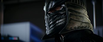 Movie still from “Teenage Mutant Ninja Turtles: Out of the Shadows” (2016), directed by Dave Green – A person wearing a metal helmet; Close Up shot, Over the shoulder angle