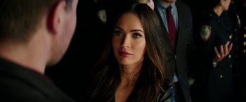 Movie still from “Teenage Mutant Ninja Turtles: Out of the Shadows” (2016), directed by Dave Green – A person wearing a suit and tie; Close Up shot, Over the shoulder angle