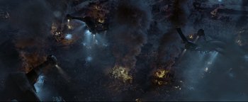 Movie still from “Terminator 3: Rise of the Machines” (2003), directed by Jonathan Mostow – An aerial view of an airplane flying through the sky; Extreme Wide shot, Overhead angle