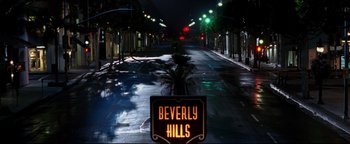 Movie still from “Terminator 3: Rise of the Machines” (2003), directed by Jonathan Mostow – A street sign on the side of the road at night; Extreme Wide shot, High angle