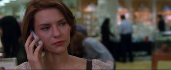 Movie still from “Terminator 3: Rise of the Machines” (2003), directed by Jonathan Mostow – A person wearing a dress; Close Up shot, Over the shoulder angle