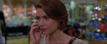 Movie still from “Terminator 3: Rise of the Machines” (2003), directed by Jonathan Mostow – A person talking on a cell phone; Close Up shot, Over the shoulder angle