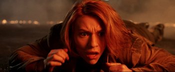 Movie still from “Terminator 3: Rise of the Machines” (2003), directed by Jonathan Mostow – A person with long red hair; Close Up shot, Low angle