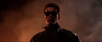 Movie still from “Terminator 3: Rise of the Machines” (2003), directed by Jonathan Mostow – A person wearing sunglasses; Close Up shot, Low angle