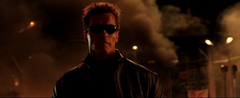 Movie still from “Terminator 3: Rise of the Machines” (2003), directed by Jonathan Mostow – A person wearing sunglasses; Close Up shot, Low angle