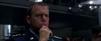 Movie still from “Terminator 3: Rise of the Machines” (2003), directed by Jonathan Mostow – A person wearing a military uniform; Close Up shot, Low angle