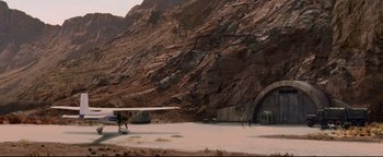 Movie still from “Terminator 3: Rise of the Machines” (2003), directed by Jonathan Mostow – An airplane sitting in the middle of the desert; Extreme Wide shot, High angle