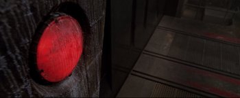 Movie still from “Terminator 3: Rise of the Machines” (2003), directed by Jonathan Mostow – A red heart on a wall; Extreme Close Up shot, Overhead angle