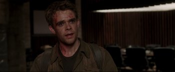 Movie still from “Terminator 3: Rise of the Machines” (2003), directed by Jonathan Mostow – A person wearing a jacket; Close Up shot, Over the shoulder angle