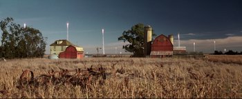 Movie still from “Terminator 3: Rise of the Machines” (2003), directed by Jonathan Mostow – An image of an old barn in the middle of a field; Extreme Wide shot, Low angle