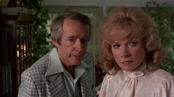 Movie still from “Terms of Endearment” (1983), directed by James L. Brooks – A man and a woman standing next to each other; Close Up shot, Over the shoulder angle