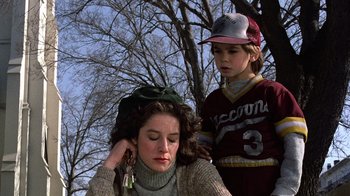 Movie still from “Terms of Endearment” (1983), directed by James L. Brooks – A woman and a boy standing next to each other; Close Up shot, Low angle