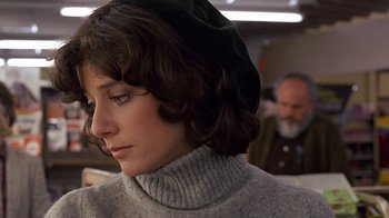 Movie still from “Terms of Endearment” (1983), directed by James L. Brooks – A person wearing a sweater; Close Up shot, Over the shoulder angle