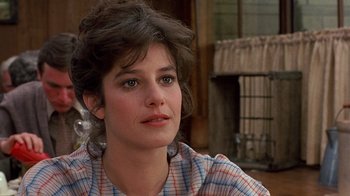 Movie still from “Terms of Endearment” (1983), directed by James L. Brooks – A person sitting on a chair; Close Up shot, Over the shoulder angle