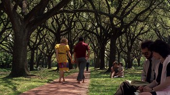 Movie still from “Terms of Endearment” (1983), directed by James L. Brooks – Two people walking down a path in a park; Wide shot, Over the shoulder angle