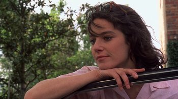 Movie still from “Terms of Endearment” (1983), directed by James L. Brooks – A woman sitting in a car with her head resting on the steering wheel; Close Up shot, Low angle