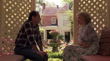 Movie still from “Terms of Endearment” (1983), directed by James L. Brooks – A man and a woman sitting on a porch; Wide shot, Over the shoulder angle