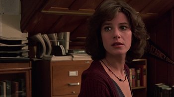 Movie still from “Terms of Endearment” (1983), directed by James L. Brooks – A person in a room near a desk; Close Up shot, Low angle