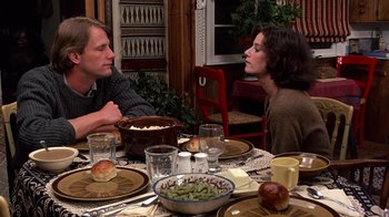 Movie still from “Terms of Endearment” (1983), directed by James L. Brooks – A man and a woman sitting at a dinner table; Medium shot, Over the shoulder angle