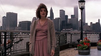 Movie still from “Terms of Endearment” (1983), directed by James L. Brooks – A woman standing in front of a body of water; Medium shot, Low angle