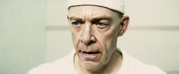 Movie still from “Thank You for Smoking” (2005), directed by Jason Reitman – A man with a bandage on his head; Close Up shot, Low angle