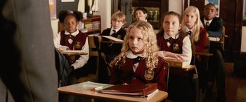 Movie still from “Thank You for Smoking” (2005), directed by Jason Reitman – A group of children sitting at a desk in a classroom; Medium shot, High angle