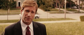 Movie still from “Thank You for Smoking” (2005), directed by Jason Reitman – A person wearing a suit and tie; Close Up shot, Over the shoulder angle